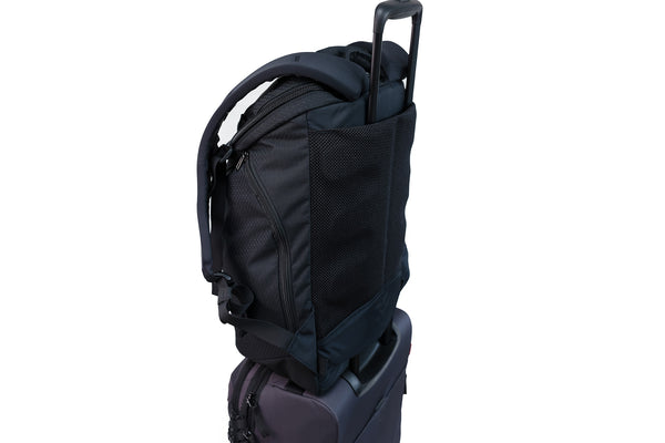 ^The Smart Alec 2.0 over the handle of a rollaboard bag.